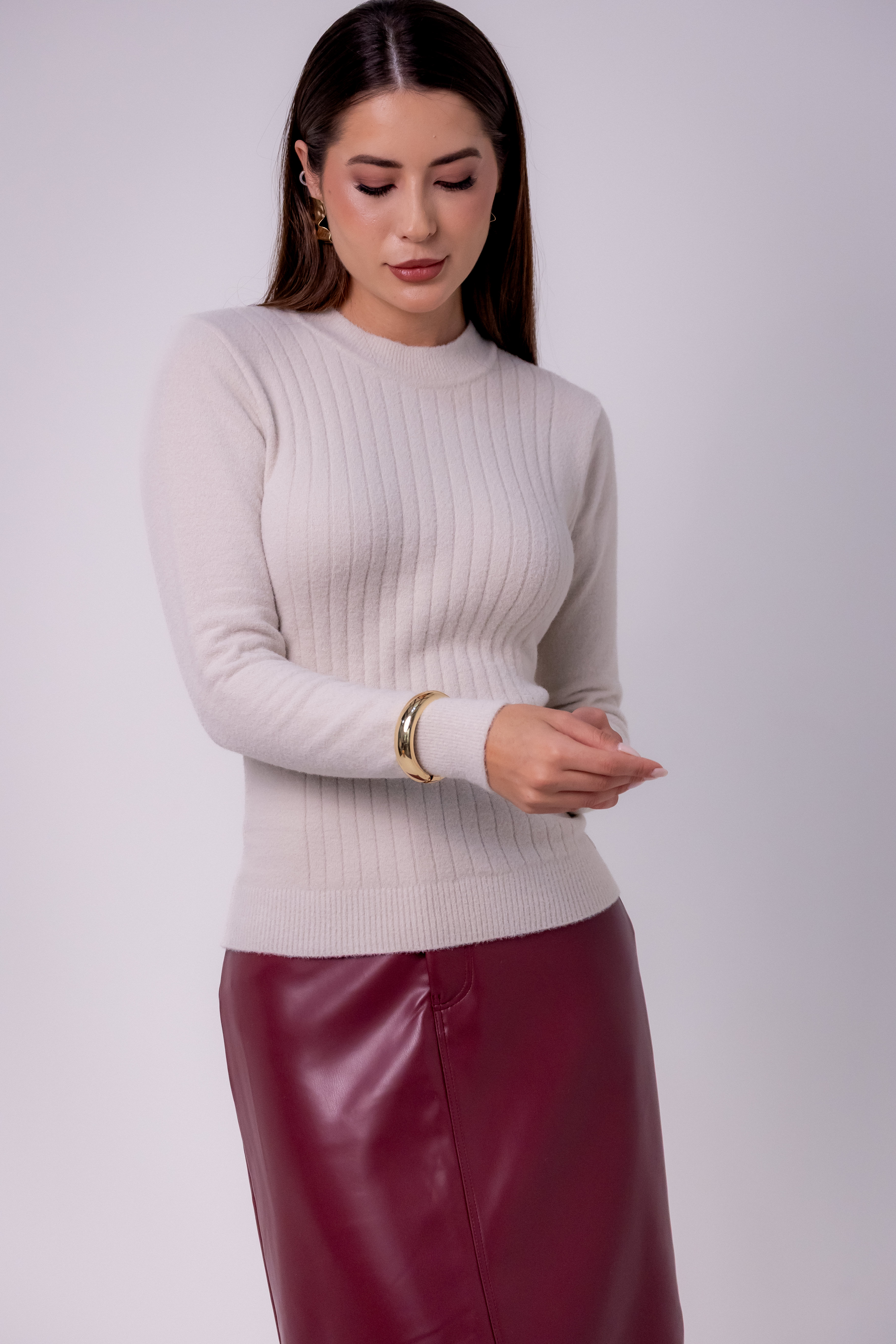 BLUSA PLUMA CANELADA NA FRENTE